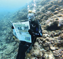 Jan Harris reads her Crossing at 45' while visiting the Kerama Islands of Okinawa, Japan.