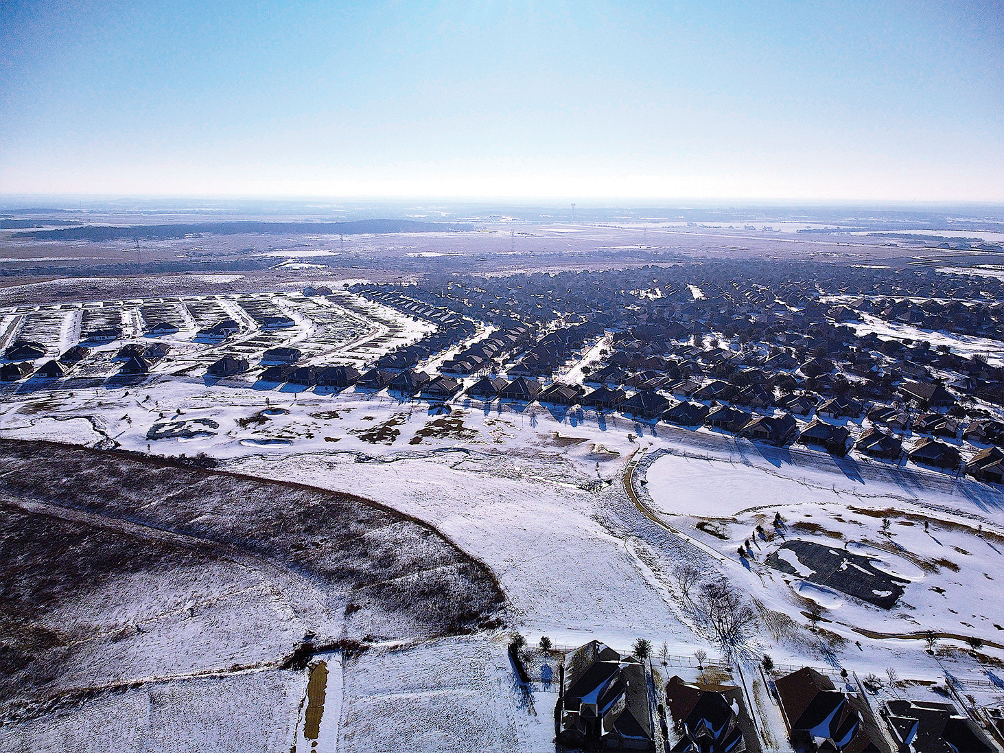 Minus 12 degrees and 40 knot gusts; photo taken on the fly as the drone passed overhead. Pond frozen and snow-covered.